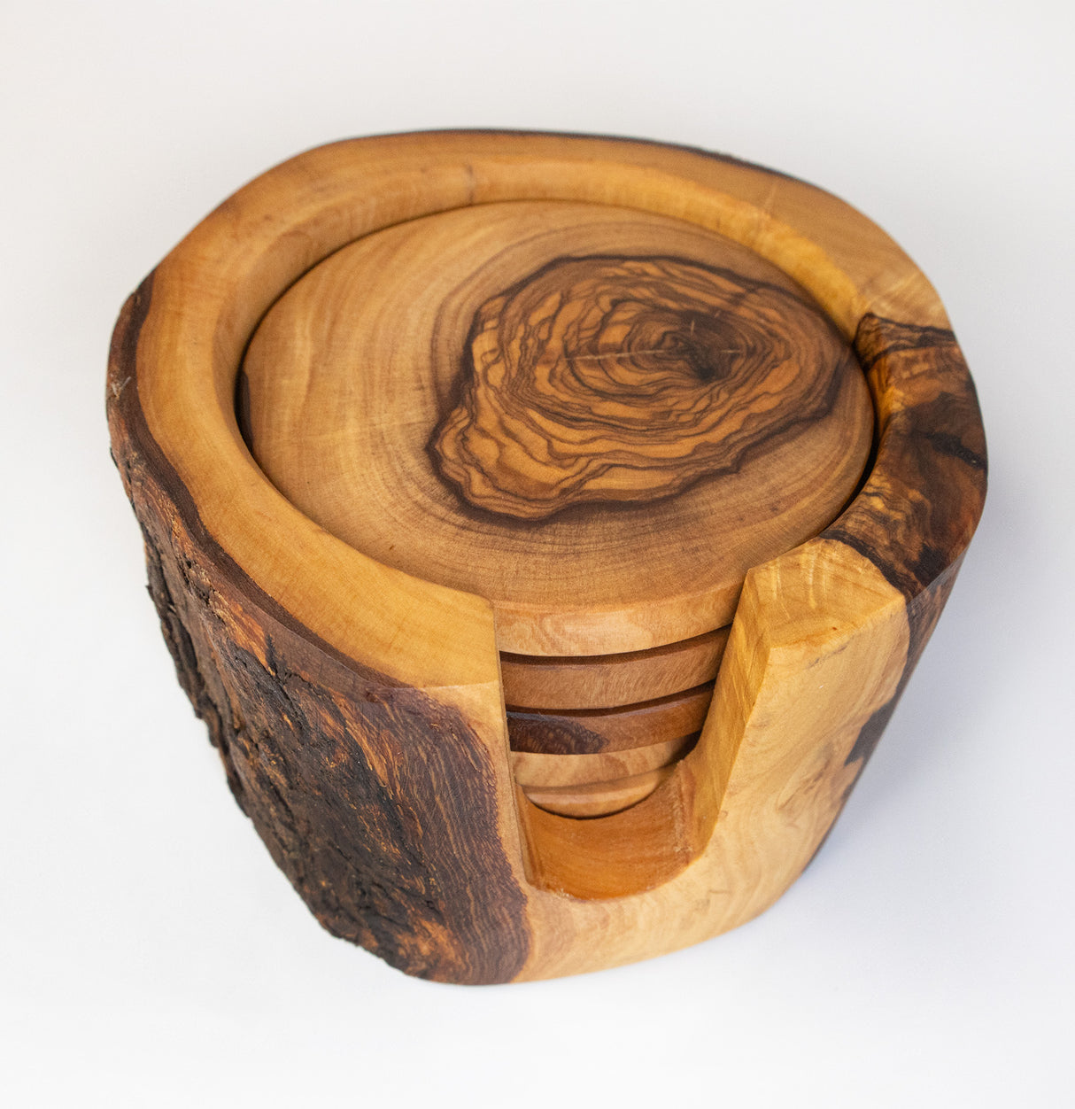 A set of six rustic olive wood coasters with a holder, featuring natural grain patterns and an organic shape.